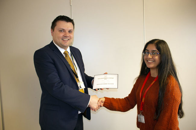 Principal presenting award to student