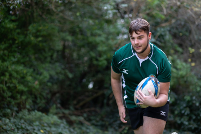 Alex Linscer running with Rugby ball