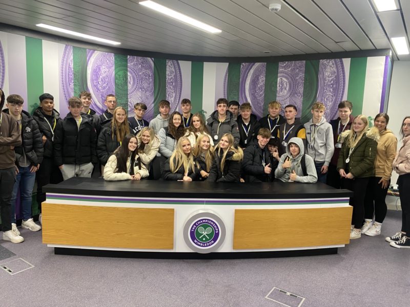 Group Photo of students at Wimbledon stadium