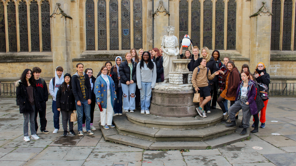 Group of Classics students standing outside Bath Abbey