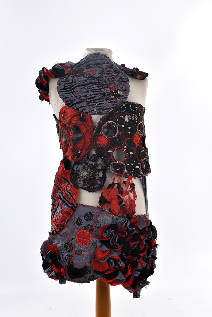 Red, black and grey dress on mannequin