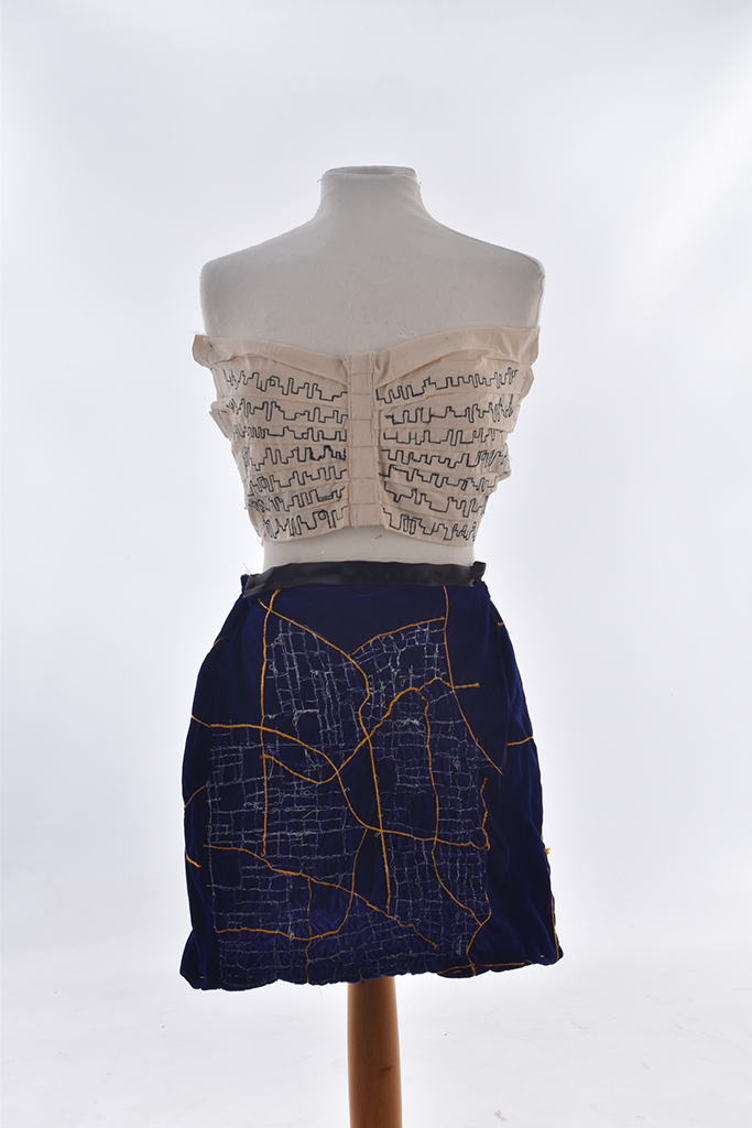 Cream strapless bodice and blue skirt on mannequin
