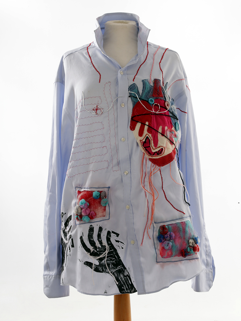 Blue shirt with collar up with applique, painted and sewn designs