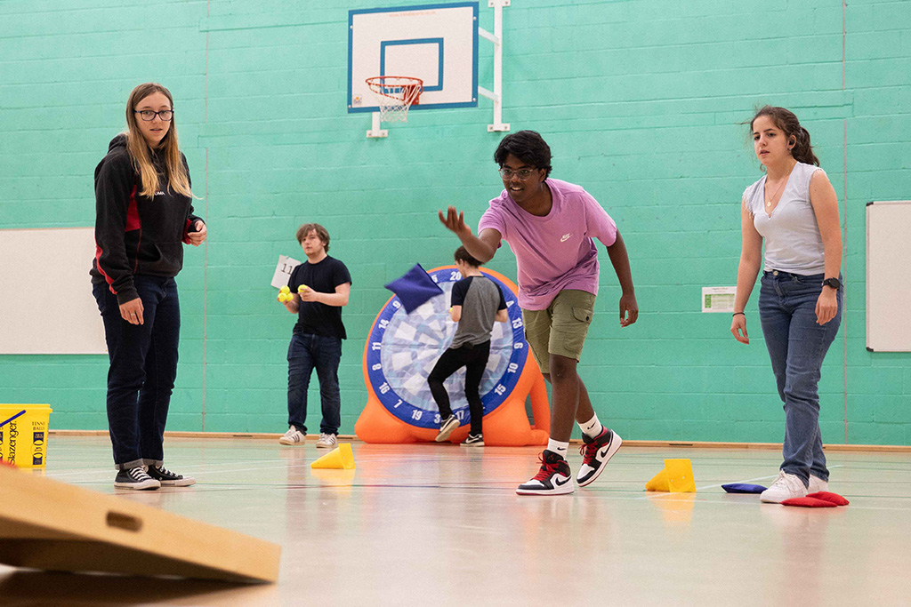 Students playing games in the sports hall