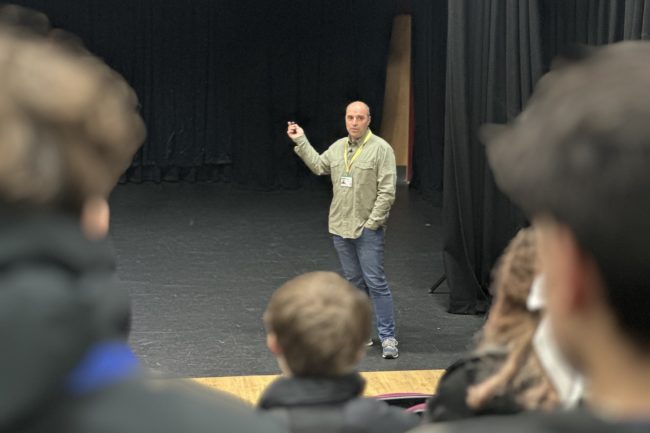 Eduardo presenting to students in the Rispoli Theatre