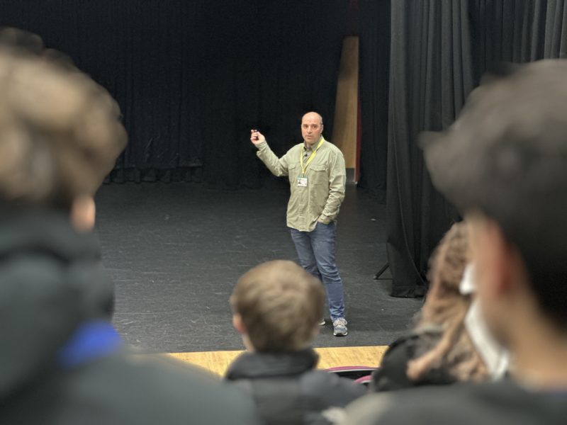 Eduardo presenting to students in the Rispoli Theatre