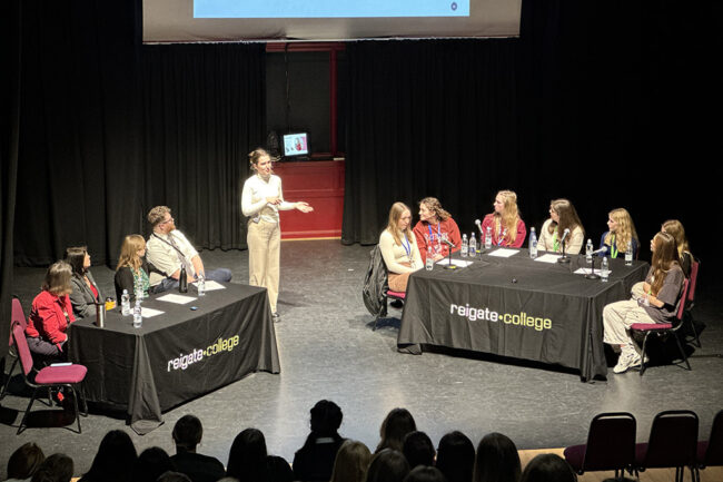Speaker on stage at the Women In Stem Applicants event