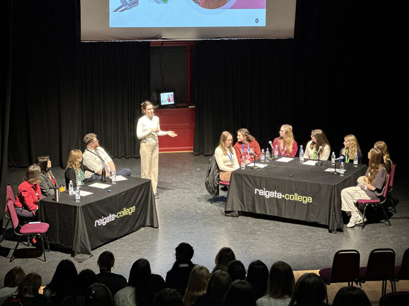 Speaker on stage at the Women In Stem Applicants event