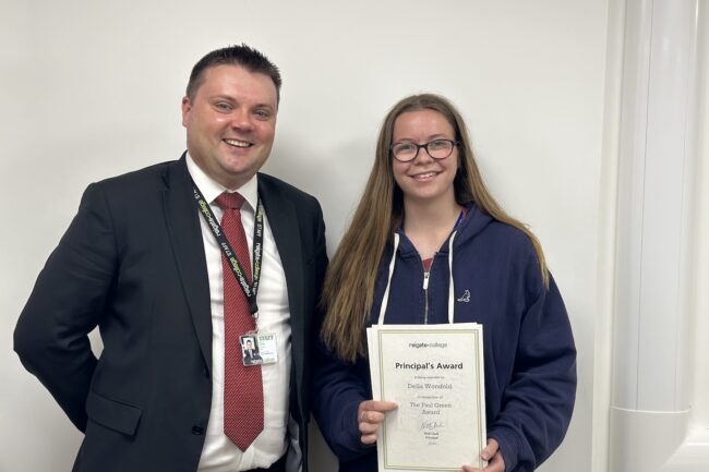 Della receiving her award from Reigate College Principal Nick Clark