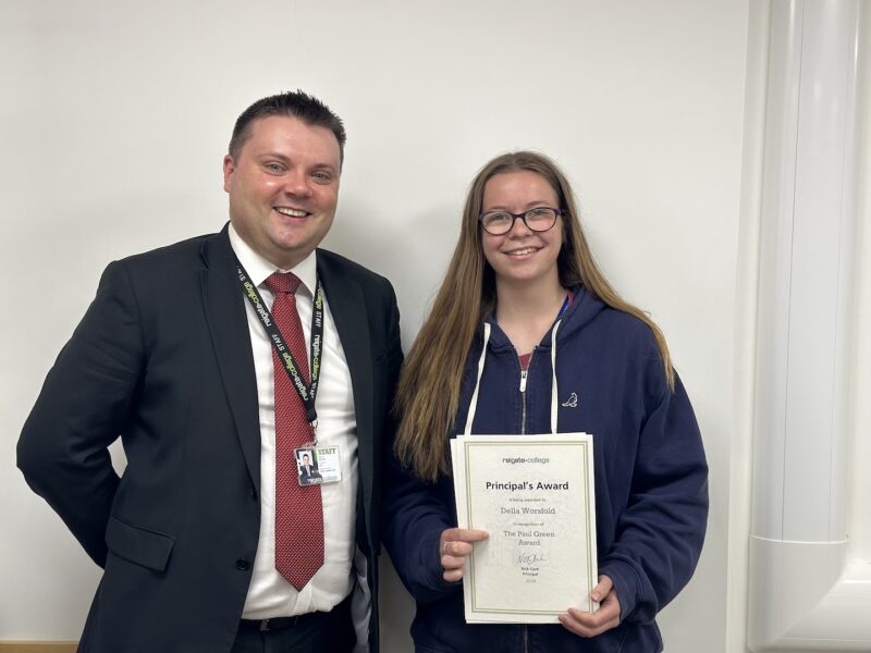 Della receiving her award from Reigate College Principal Nick Clark