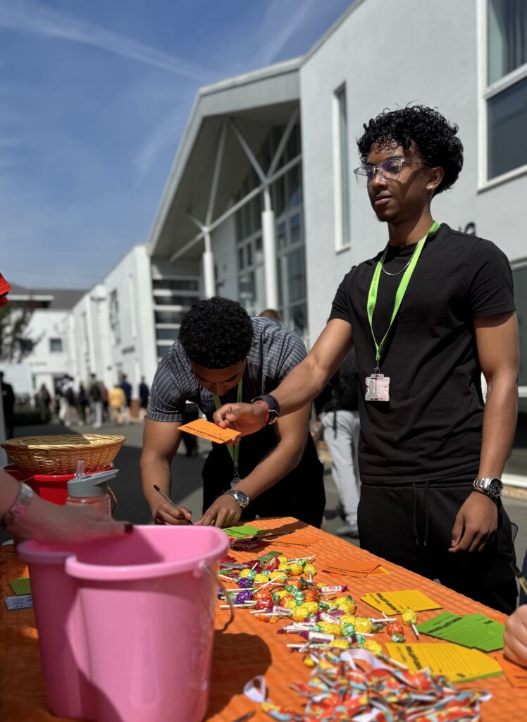 Students writing shout-out notes for staffs at college