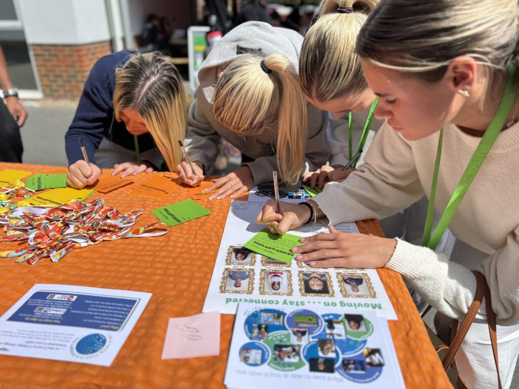 Students writing shout-out notes for staffs at college