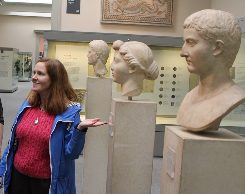 Head of Classics Sarah Bell in front of the Building Imperial Rome exhibit