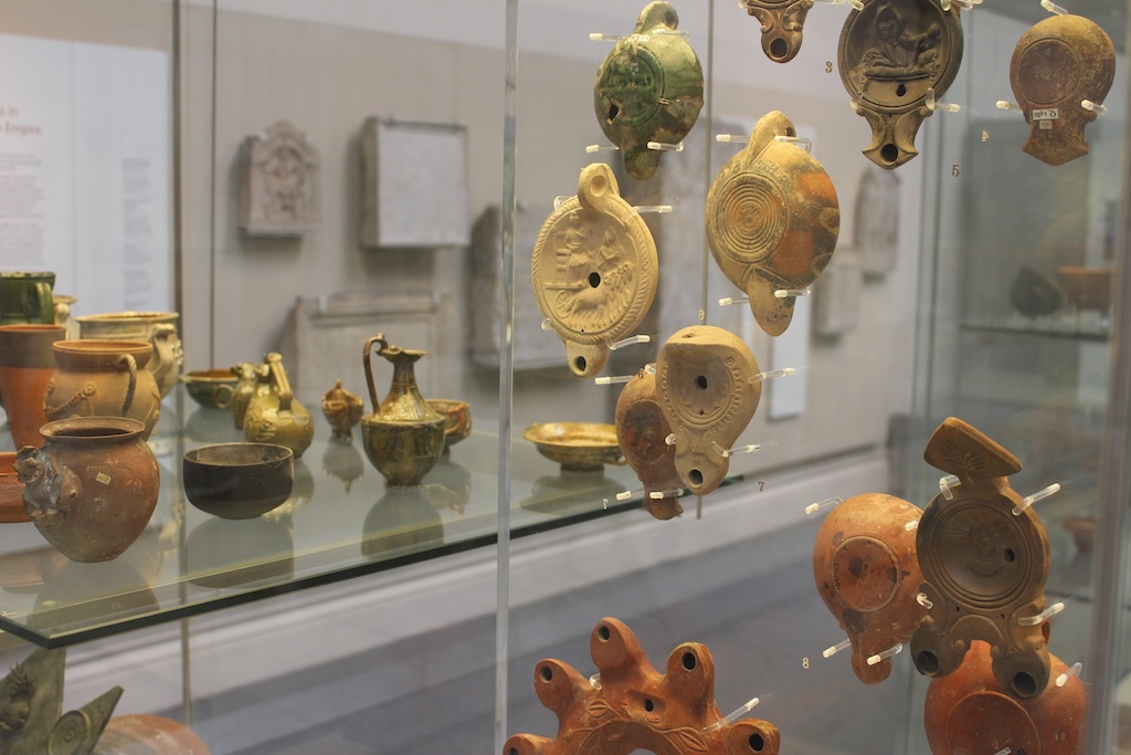 Ancient artefacts inside a glass display case in the British Museum