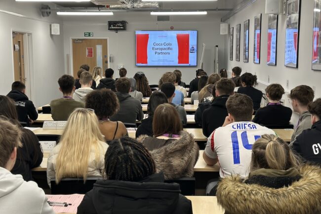 Students listen to presentation