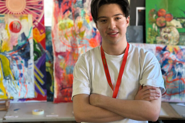 Eduardo in front of art work