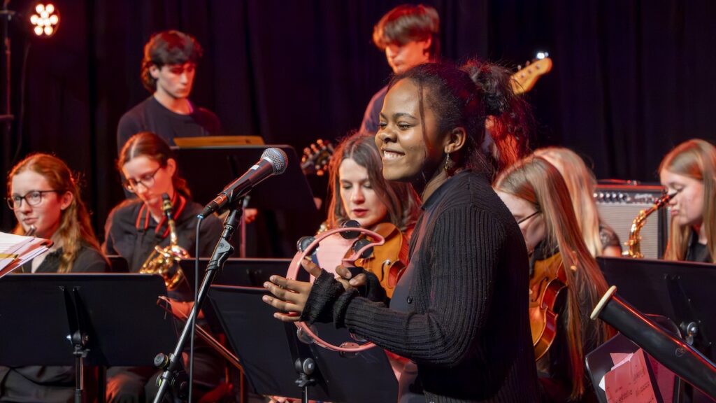 Students performing on stage in the Spring Concert