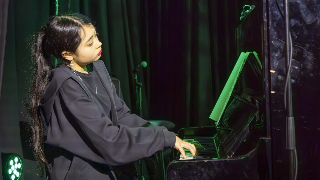 Students performing on stage in the Spring Concert