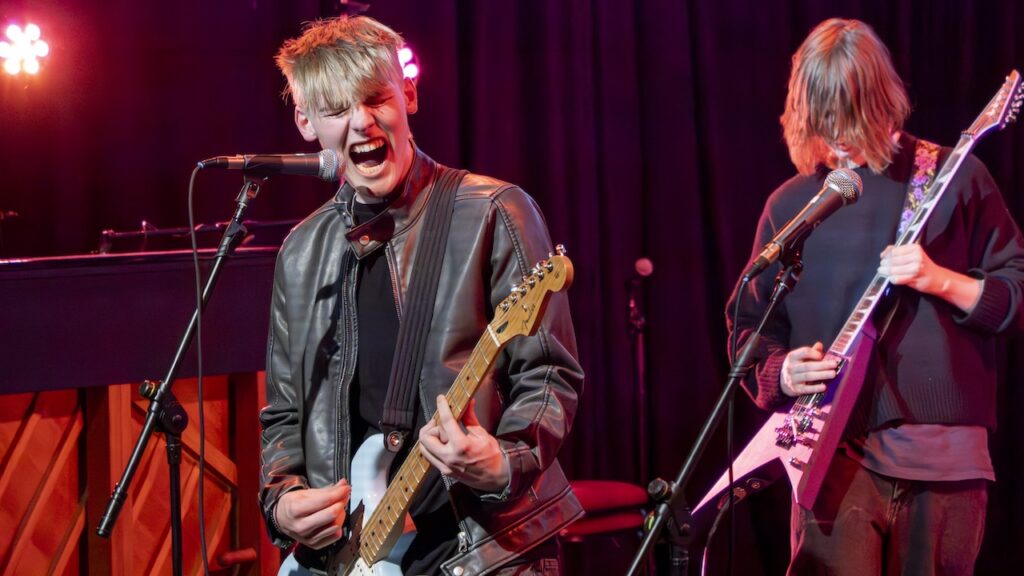 Students performing on stage in the Spring Concert