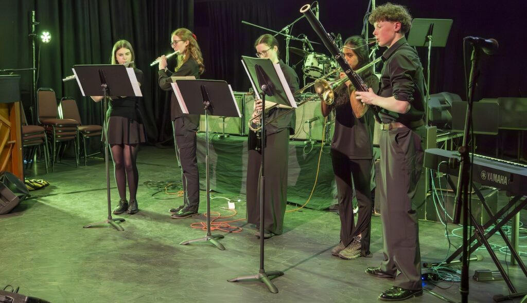 Students performing on stage in the Spring Concert