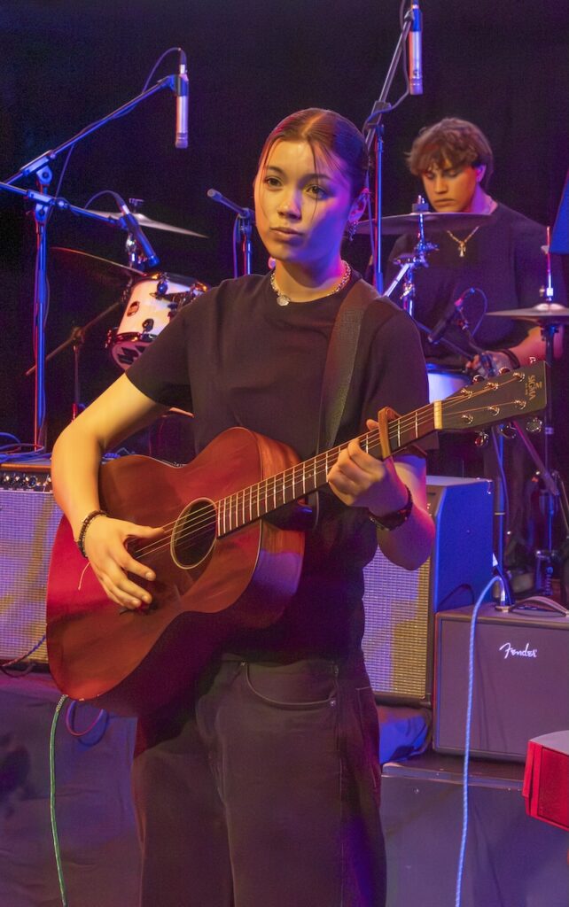 Students performing on stage in the Spring Concert