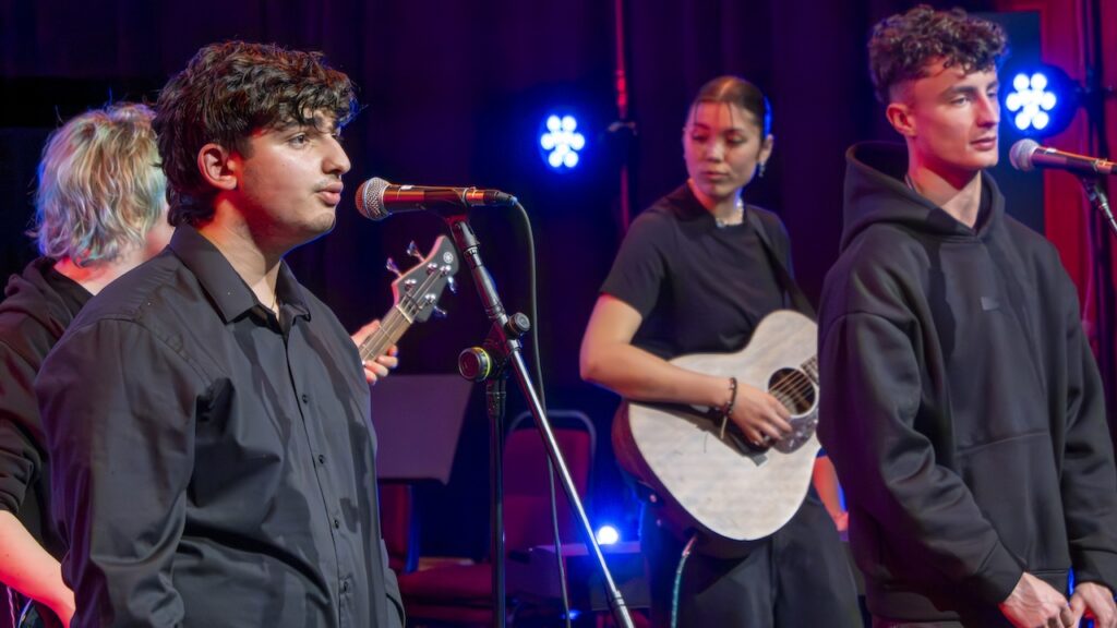Students performing on stage in the Spring Concert