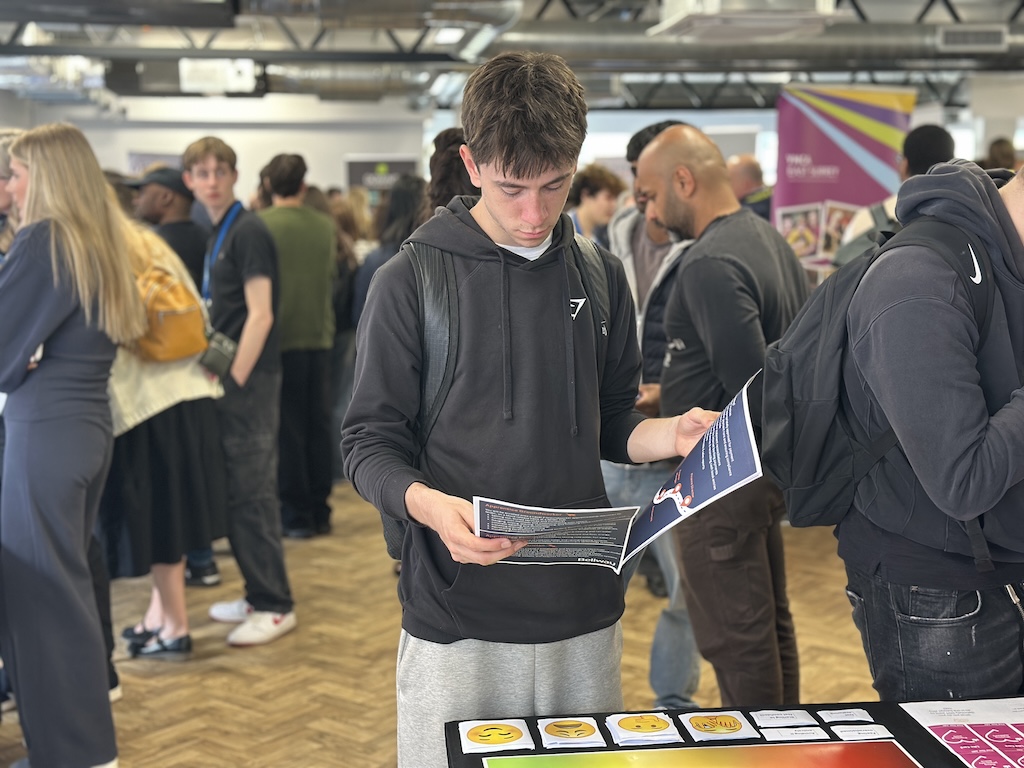 Student looking at leaflets