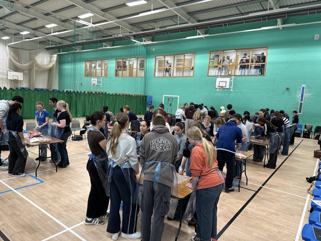 Group shot of students getting hands-on experience of dissection