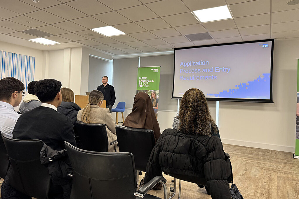 Students listening to a talk during the RSM insight visit