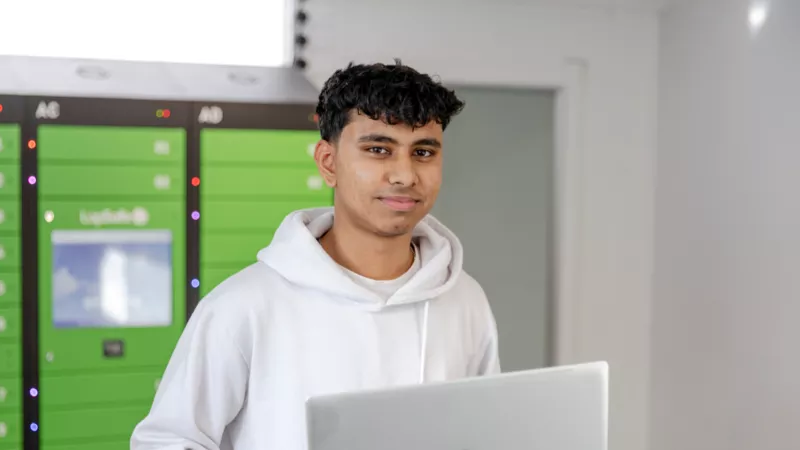 Male student with laptop